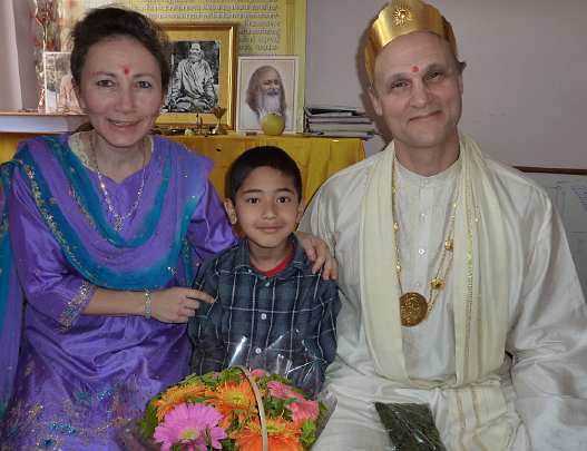 18-Raam Navami Celebration, Katmandu NMVF Center - 18.jpg - Raja Kingsley and Mother of the Domain Leslie with the child of a Nepalese Teacher of Transcendental Meditation who is the primary recruiter for Napalese students to come to Maharishi University of Management. Many of these students come for the Computer Science and the Accounting programmes and are some of the top students at MUM and will create a basis for a strong Nepal.